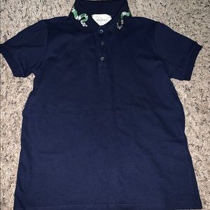 Navy blue Gucci polo shirt.